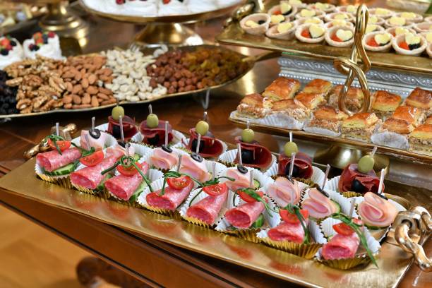 istock Lavish display of assorted appetizers and desserts on a buffet table 2183090340
