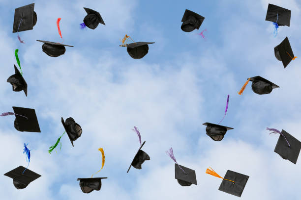 istock Graduation caps thrown in the sky 2183090656