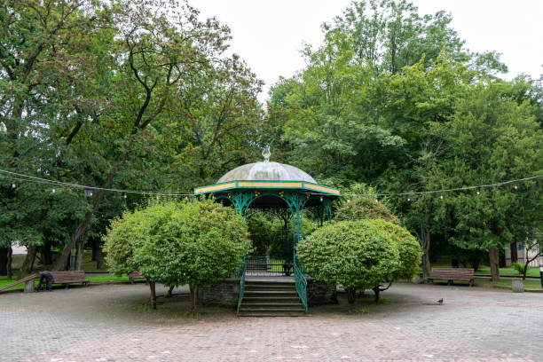 istock Gazebo on the street. Green trees rest zone 2183090679