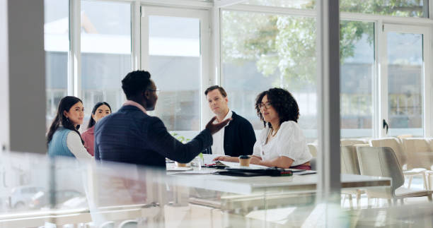 istock Collaboration, development and meeting with business people in office for discussion or planning. Boardroom, seminar or workshop with corporate men and women in workplace for strategy or vision 2183091207