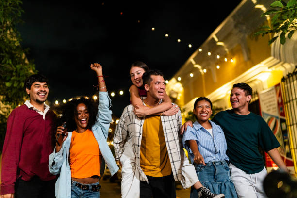 istock Young friends talking and walking outdoors 2183091925