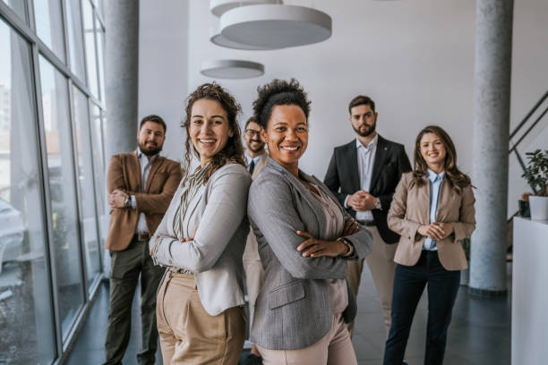 istock Diverse business team posing with arms crossed in modern office setting 2183092064