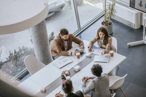 istock Business professionals collaborating at a modern office meeting table 2183092472