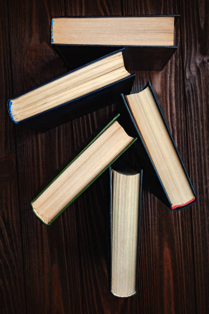 istock Old books . Stack of old hardcover books stacked on a table. 2183093061
