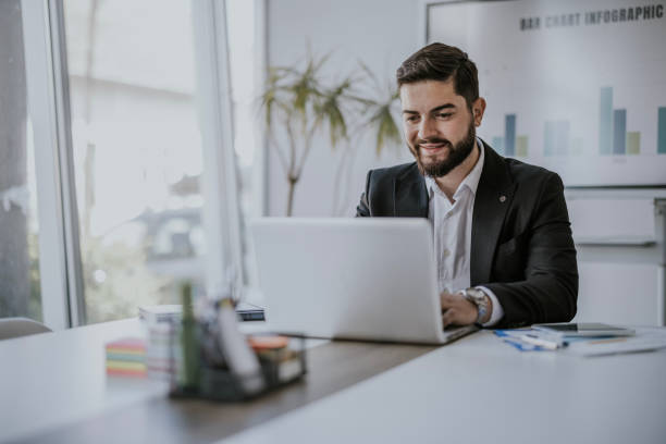 istock Businessman working on laptop in office during daytime 2183093082