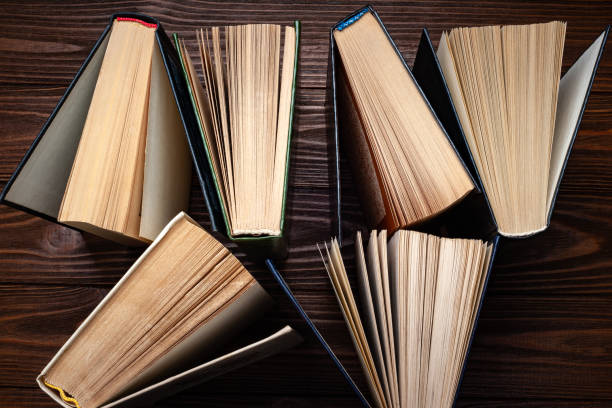 istock Old books . Top view of a stack of old open books stacked on a table. 2183093197