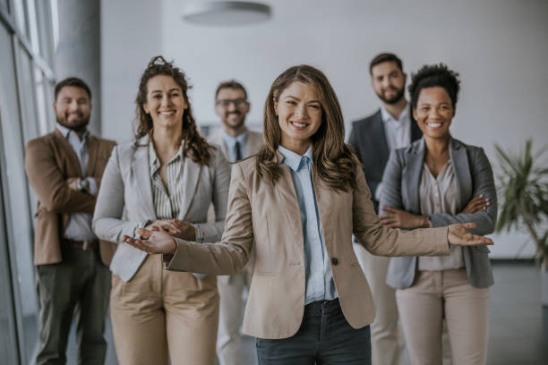 istock Confident businesswoman leading team in modern office 2183093784