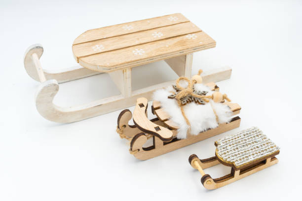 istock Three wooden toy sledges in different sizes. 2183098029