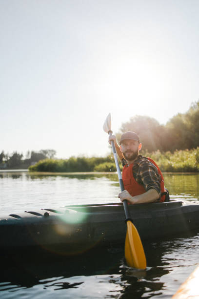 istock A satisfied man actively kayaking on the lake 2183099326