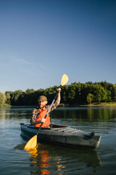 istock A satisfied man actively kayaking on the lake 2183099426