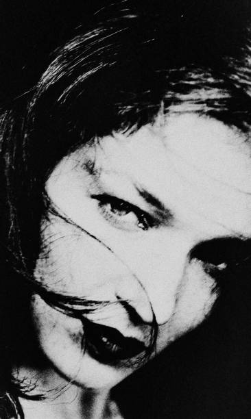istock The woman in the darkness. 2183099477