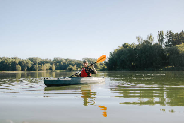istock A satisfied man actively kayaking on the lake 2183100220