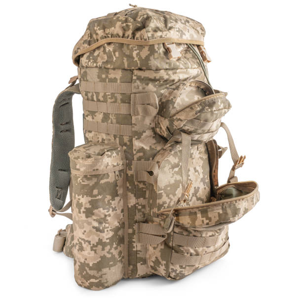 istock Military backpack in pixel camouflage. Tactical military ammunition. 2183101160
