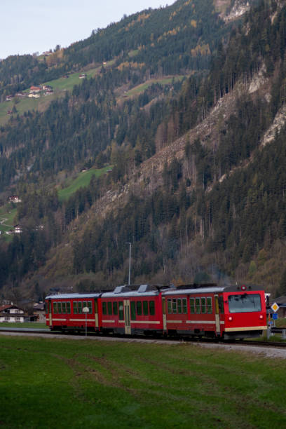 istock Alpine train in the mountains. Austrian alps train. Public transportation in nature. 2183101283