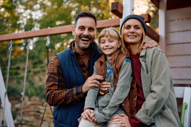 istock Happy family on the playground during autumn looking at camera. 2183102707