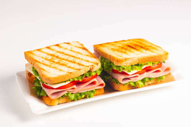istock Club sandwich with ham, cheese, tomato and lettuce 2183103376