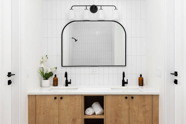 istock A bathroom with a white oak cabinet and white subway tile backsplash. 2183111482