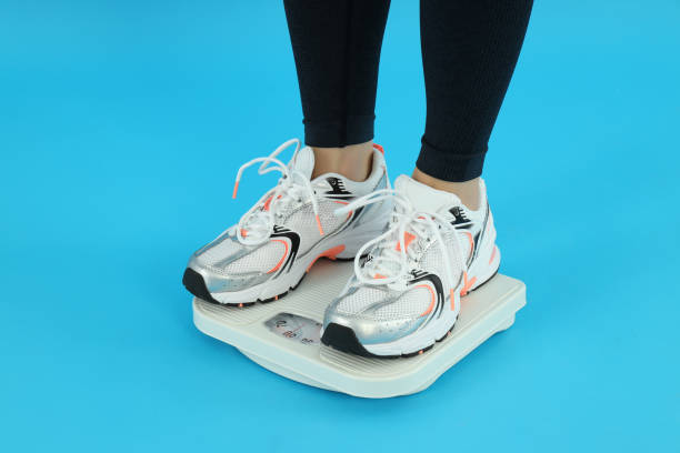 istock Concept of weight loss on blue background 2183112649