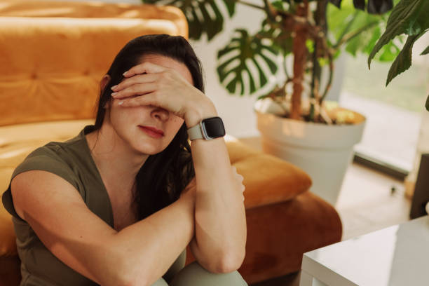 istock Young Woman Experiencing Stress at Home with Plants 2183114154