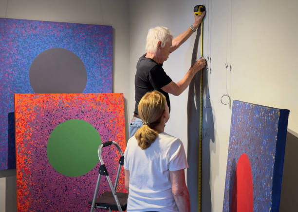 istock IMG_1242 Measuring before hanging paintings 2183115814