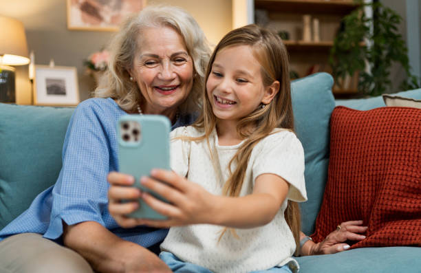 istock Grandmother and granddaughter taking selfies 2183115844