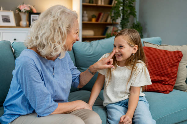 istock Grandmother enjoying wit her granddaughter at home 2183118024