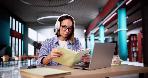 istock University Student In Library With Laptop 2183118649