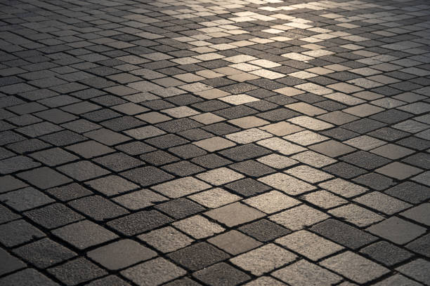 istock gray cobbled road from concrete pavers 2183119949