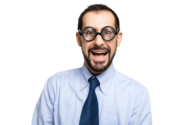 Portrait of a surprised businessman wearing thick glasses and a blue shirt