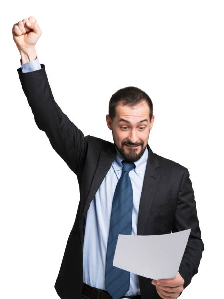 istock Mid adult businessman celebrating success while reading a document 2183125744