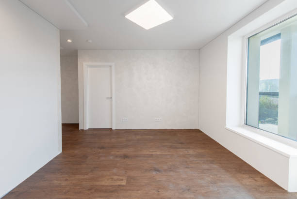 istock Empty Living Room or Bedroom Interior. White Walls Room Corner and Window. Interior with Empty Room White Walls and Wooden Floor. 2183127719