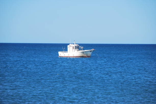 istock Lonely boat in the mediterranean sea 2183127853