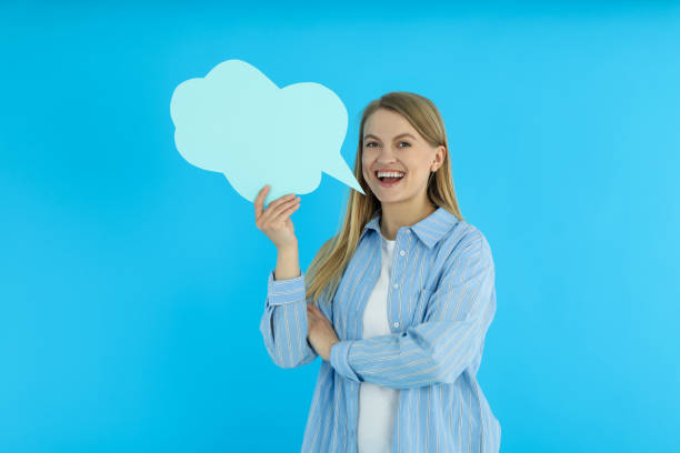istock Young woman and talk cloud on blue background 2183127976