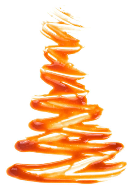 Caramel sauce swirl isolated on a white background, top view. Liquid caramel.