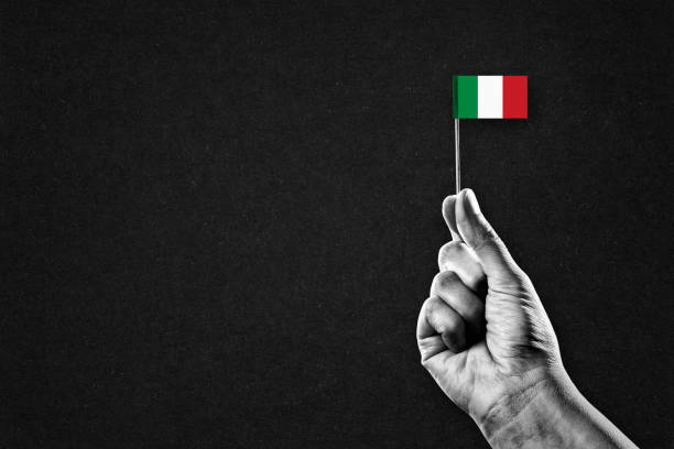 Hand in Black and White Holding Flag of Italy, Copy Space