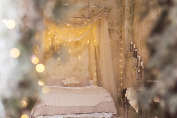 istock Christmas bedroom with baldachin and candles 2183131449