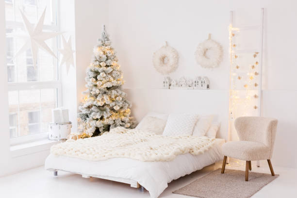 istock Cozy white bedroom with Christmas tree 2183131859