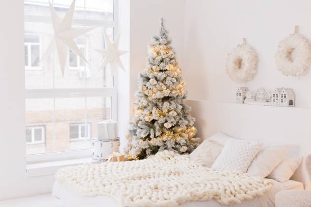 istock Cozy white bedroom with Christmas tree 2183131930