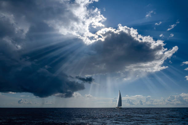 A boat sailing on the Aegean Sea with its sails full on a sunny day