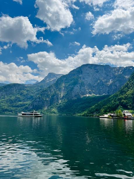 istock Scenic lake with mountains under a clear blue sky in Hallstatt, Austria. 2183133917