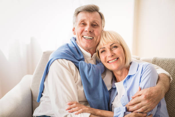 istock Tender moments. Romantic senior couple sitting on couch 2183134970
