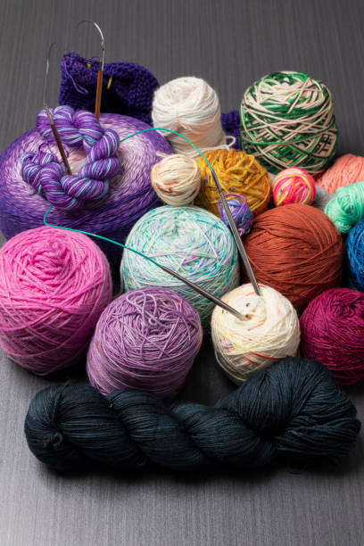 istock Coloured wools of different textures, soft and colourful, together with knitting needles 2183140163