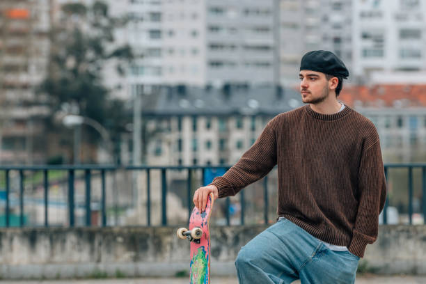 young man on the street with skateboard