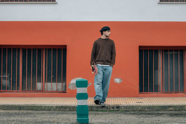 istock young man on the street with skateboard 2183141866