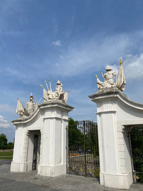 istock Ornate stone gate with sculptures under a blue sky in Bratislava. 2183142575