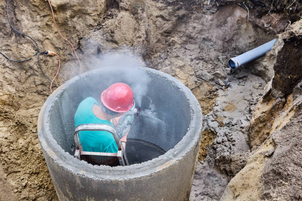 istock Diamond cutting wheel attached on angle grinder sawing concrete ring of septic tank. 2183144861