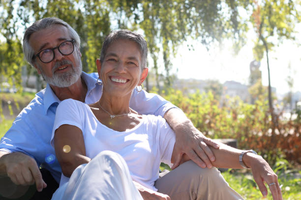 istock An exchange of affection senior couple on bench 2183150834