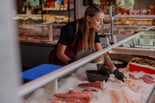 istock An expert fishmonger showcases an impressive seafood display to customers and patrons 2183156671
