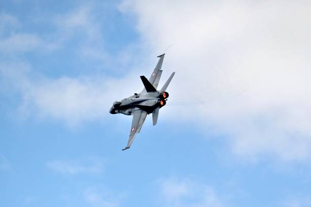 Swiss Air Force F/A18 fighter jets perform a flysight over Lake Geneva on August 16, 2024.