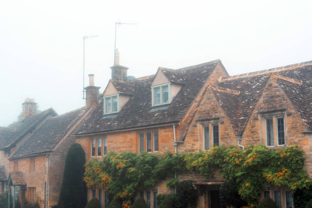 Red brick houses at Lower Slaughter in fog
